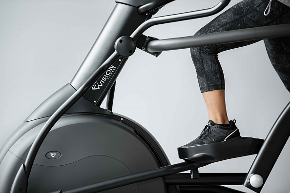 VF23_LIFESTYLE_LC female legs working out_elliptical_profile close_lores